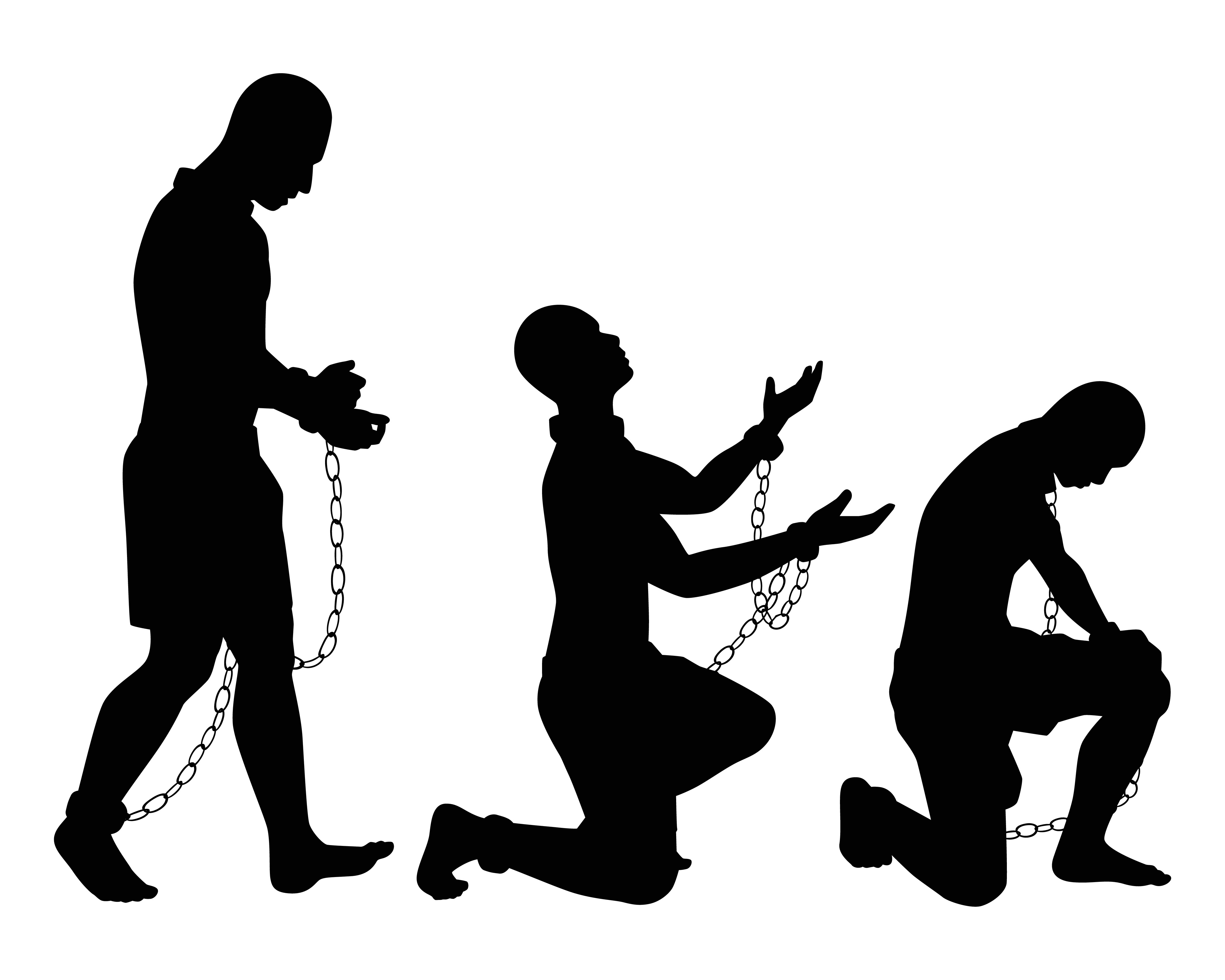 three black slaves in chains kneeling